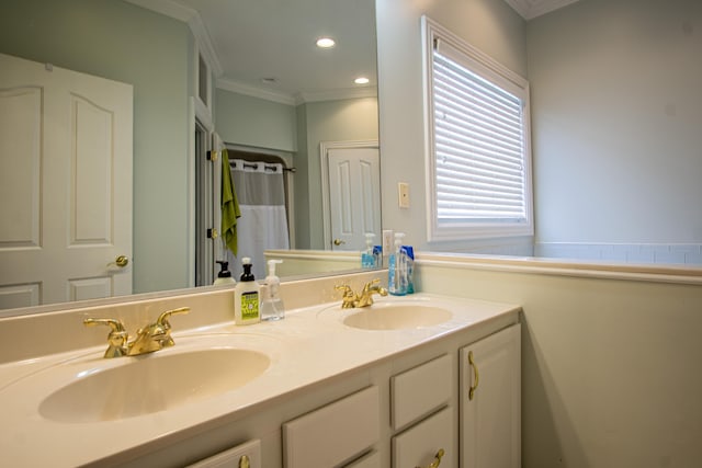 bathroom featuring double vanity, ornamental molding, a sink, and recessed lighting