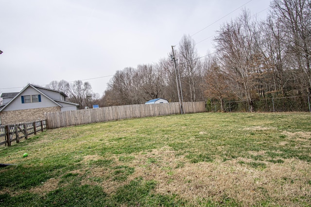 view of yard featuring fence