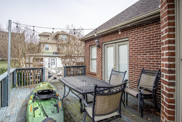 wooden deck featuring cooling unit and outdoor dining area