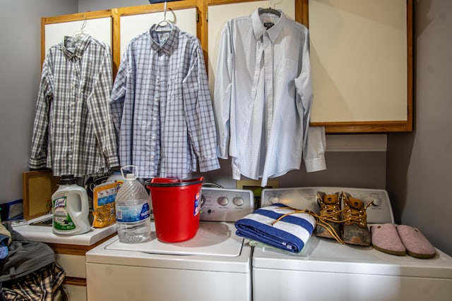 laundry room with laundry area and washing machine and clothes dryer