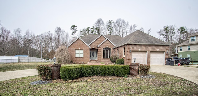 view of front of property featuring a shingled roof, concrete driveway, an attached garage, fence, and brick siding