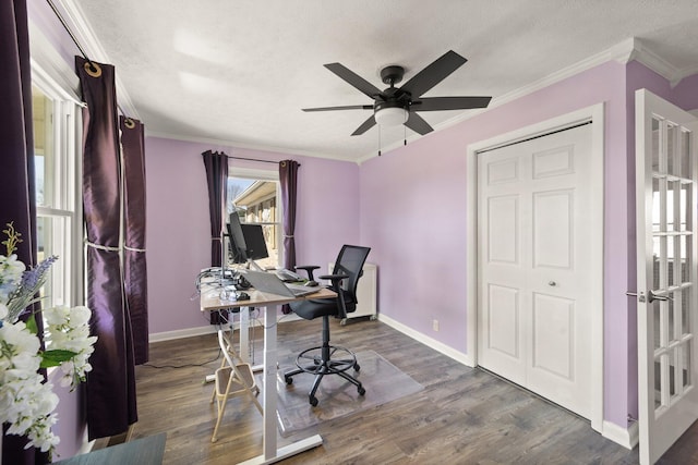 office with a textured ceiling, ornamental molding, wood finished floors, and baseboards