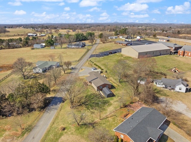 birds eye view of property featuring a rural view