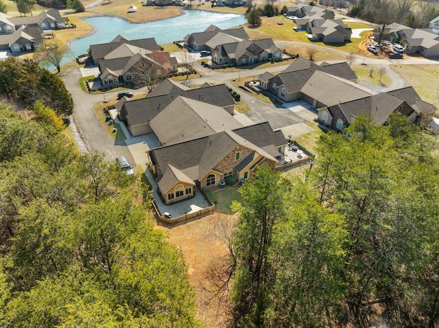 aerial view with a water view and a residential view