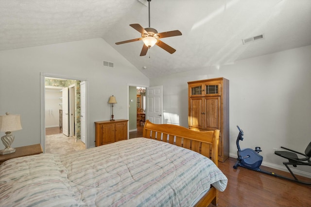 bedroom with a ceiling fan, baseboards, visible vents, and wood finished floors