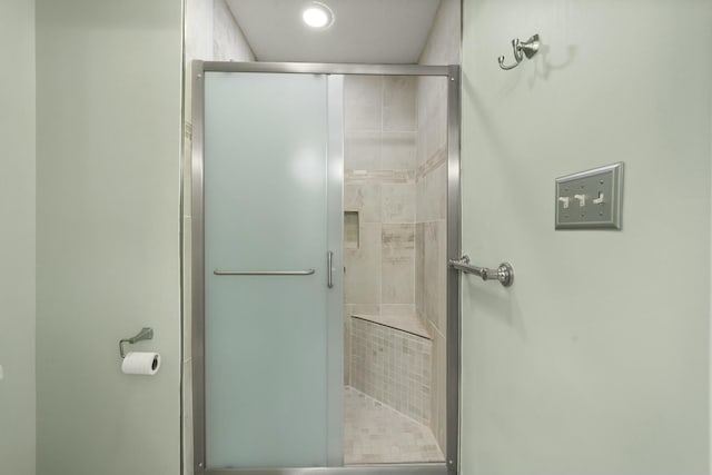 full bath featuring a shower stall