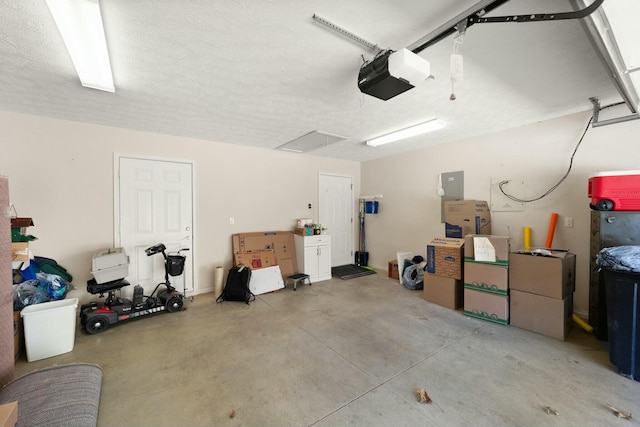 garage featuring a garage door opener and electric panel