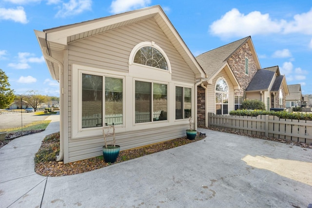 exterior space with stone siding