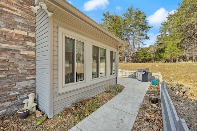 view of side of home featuring brick siding