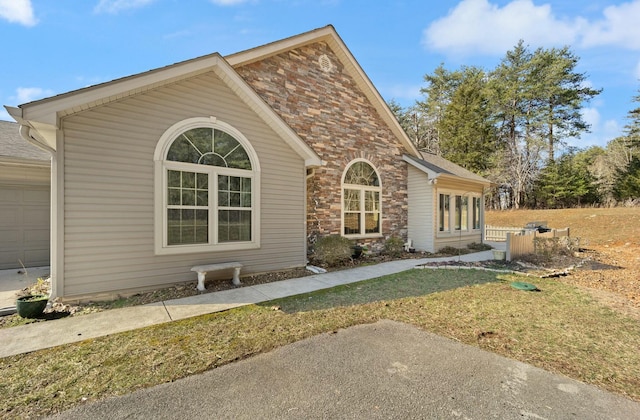 view of home's exterior with brick siding