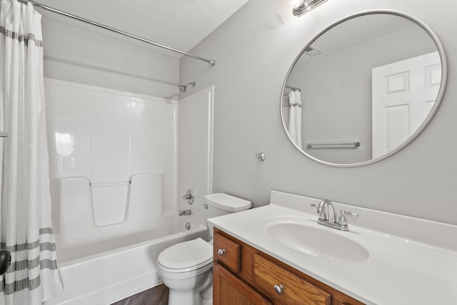 bathroom featuring shower / tub combo, vanity, and toilet