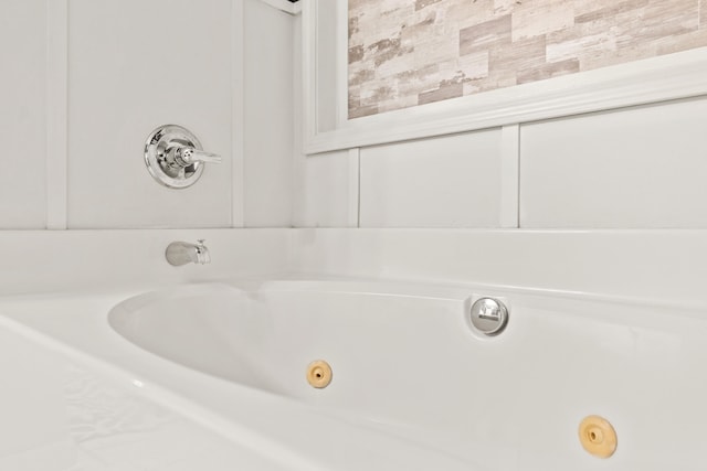 full bath featuring a whirlpool tub