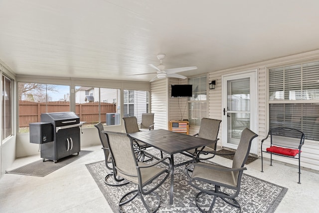 sunroom featuring ceiling fan