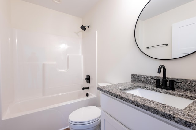 full bathroom with tub / shower combination, vanity, and toilet