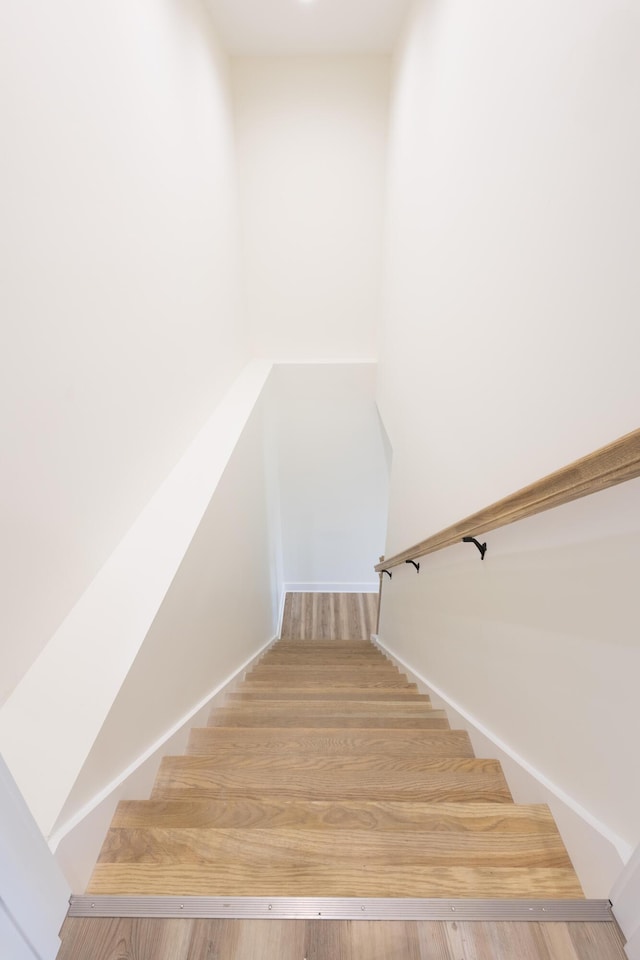 stairs with wood finished floors