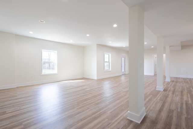 interior space featuring baseboards, recessed lighting, and light wood-style floors