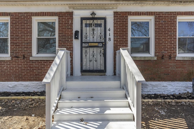 entrance to property with brick siding