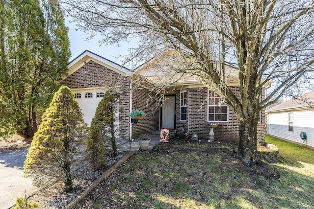 view of front facade featuring brick siding and an attached garage