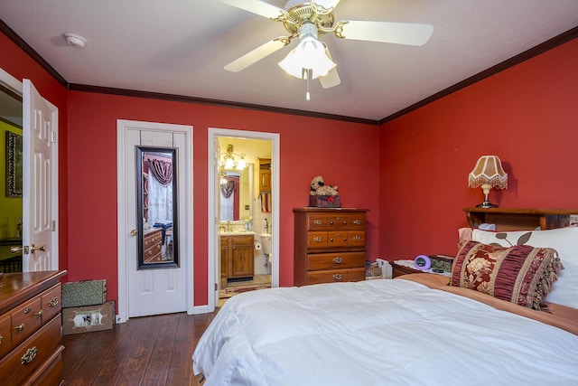 bedroom featuring dark wood-type flooring, a ceiling fan, ensuite bathroom, and ornamental molding