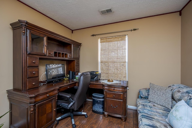 office area with visible vents, crown molding, a textured ceiling, and dark wood-type flooring