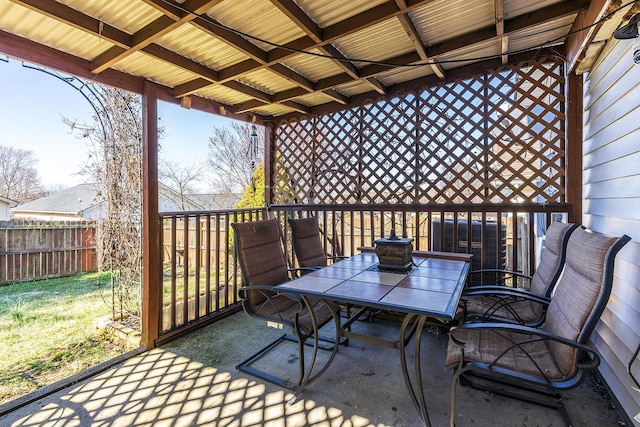 view of patio / terrace with outdoor dining space and fence