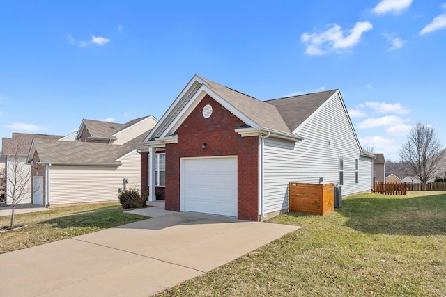 single story home featuring brick siding, concrete driveway, an attached garage, fence, and a front lawn