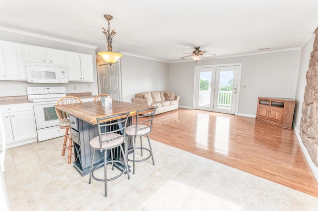 1276 Garland Rd, Burnside, KY 42519 - kitchen with white appliances, white cabinetry, a ceiling fan, ornamental molding, and open floor plan