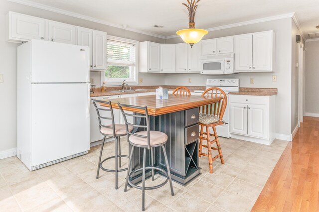 1276 Garland Rd, Burnside, KY 42519 - kitchen featuring white appliances, white cabinetry, ornamental molding, a breakfast bar area, and wooden counters