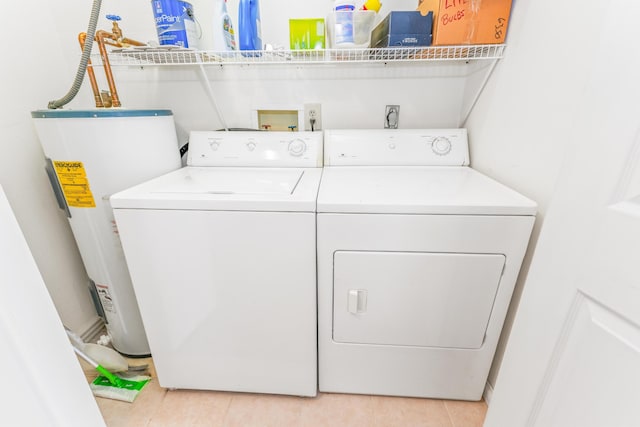 1276 Garland Rd, Burnside, KY 42519 - laundry area with water heater, independent washer and dryer, and light tile patterned floors