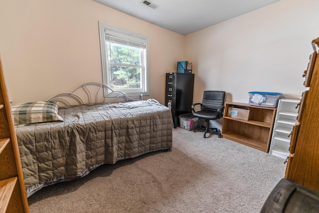 carpeted bedroom with visible vents