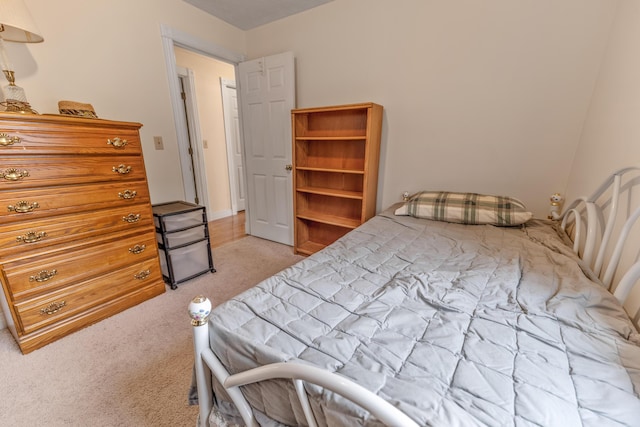 bedroom with light colored carpet