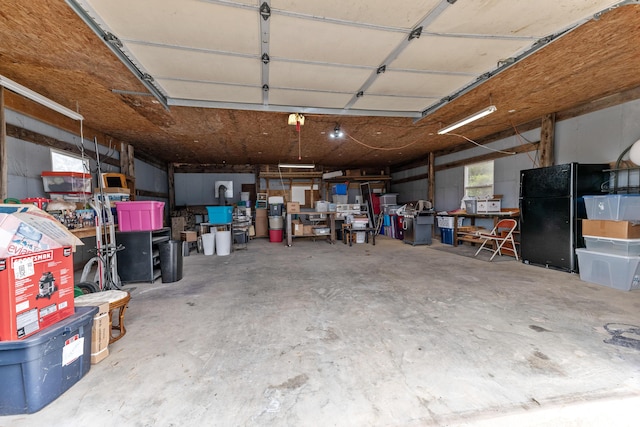 garage with freestanding refrigerator