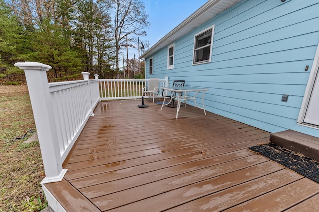 wooden deck with outdoor dining area