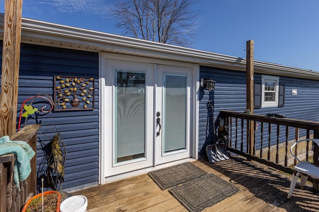 doorway to property featuring french doors and a wooden deck