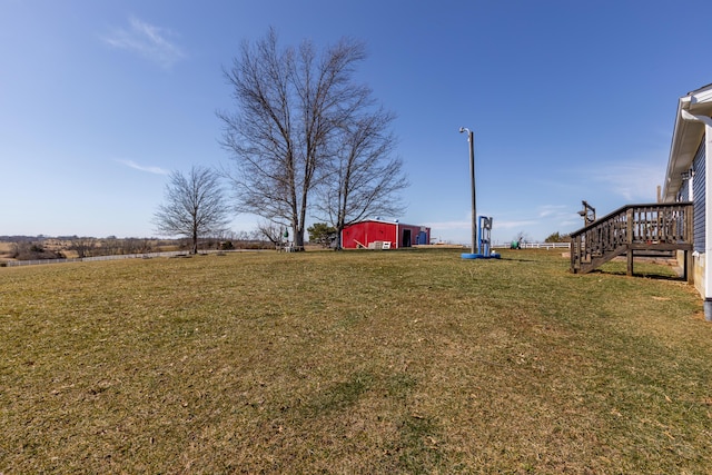 view of yard with an outbuilding and a pole building