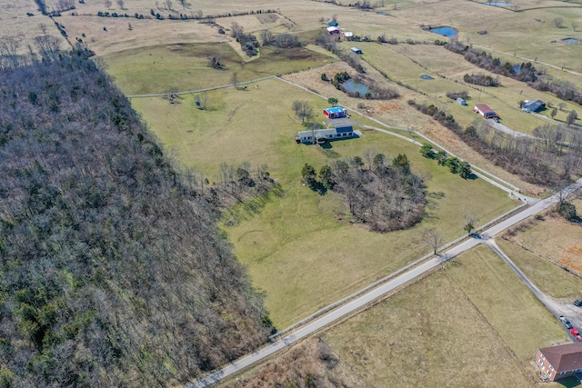 birds eye view of property with a rural view