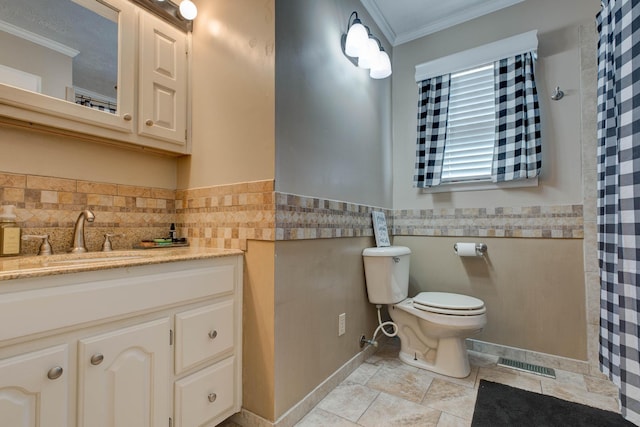 bathroom featuring crown molding, visible vents, toilet, wainscoting, and vanity