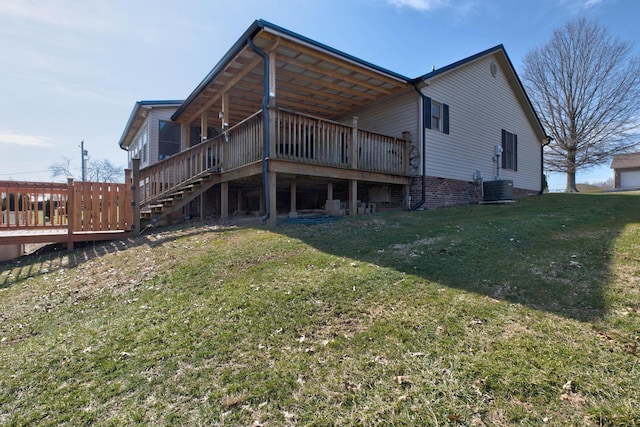 rear view of house with stairs, a lawn, cooling unit, and a wooden deck