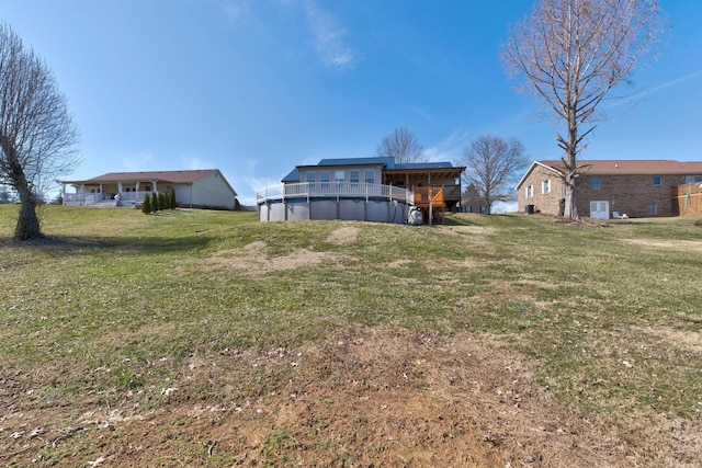 rear view of house featuring a lawn