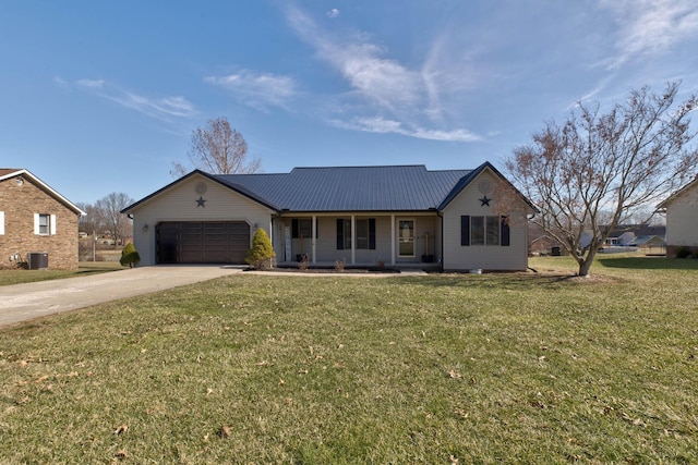 ranch-style home with a front yard, metal roof, driveway, and an attached garage