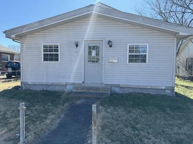 view of front of home featuring fence