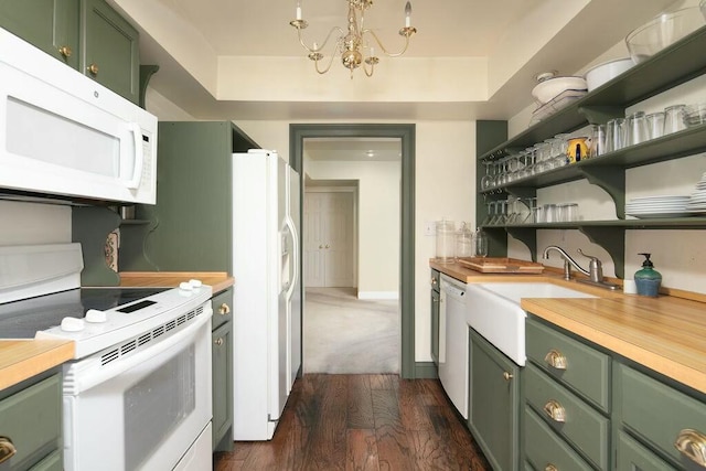 kitchen featuring white appliances, green cabinetry, dark wood-type flooring, a chandelier, and a sink