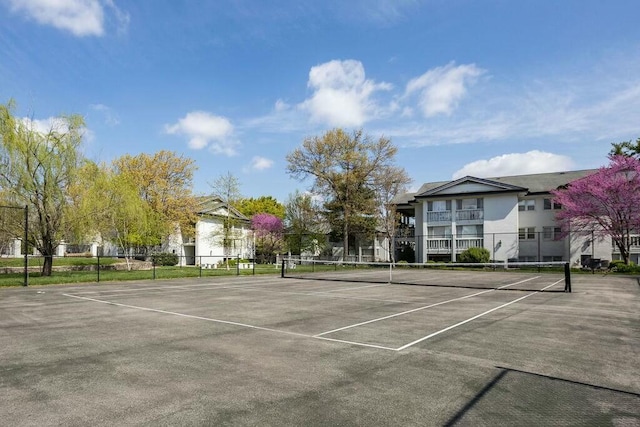 view of sport court with fence