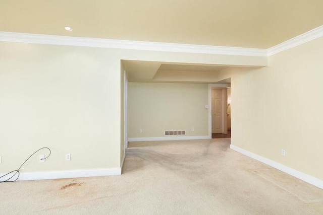 spare room featuring baseboards, visible vents, light colored carpet, crown molding, and recessed lighting