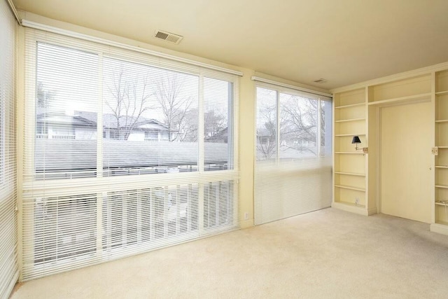 sunroom featuring visible vents