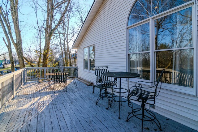 wooden deck with outdoor dining space