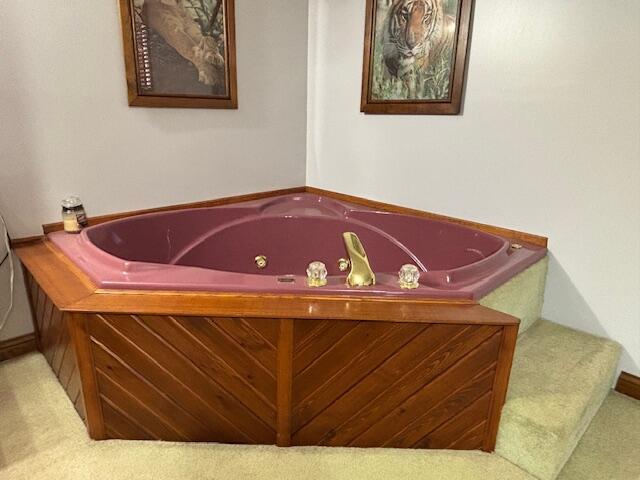 bathroom featuring a jetted tub