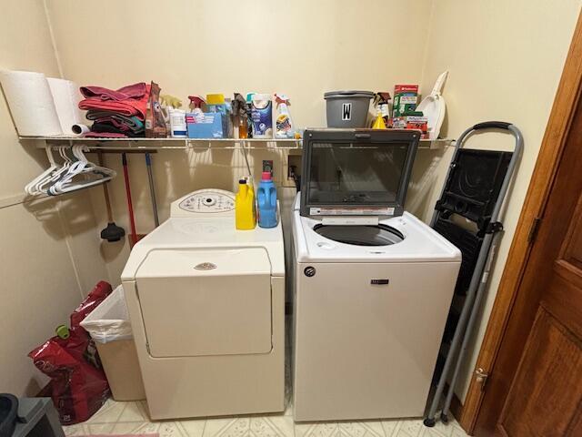 washroom with laundry area and separate washer and dryer