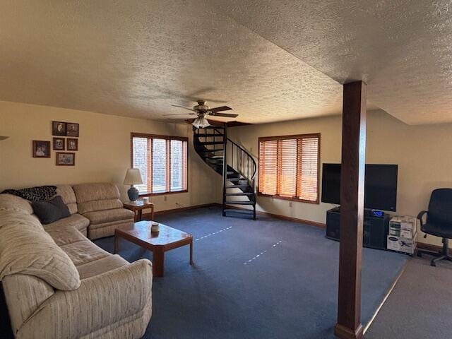 living room featuring carpet, ceiling fan, baseboards, and stairs