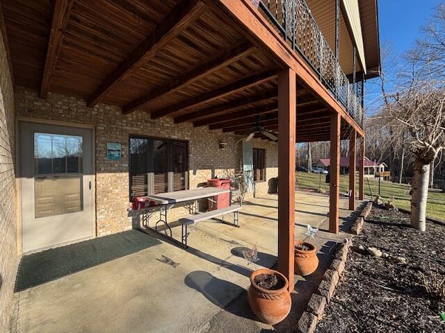 view of patio / terrace featuring ceiling fan